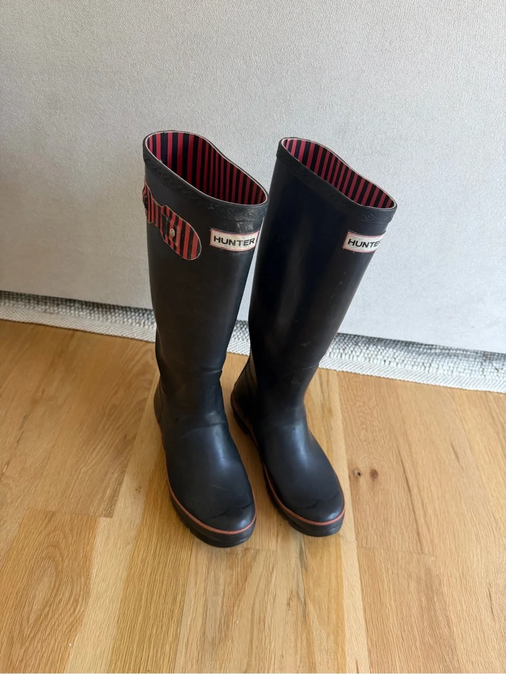 Hunter Black Tall Rain Boots with Red Stripe Lining